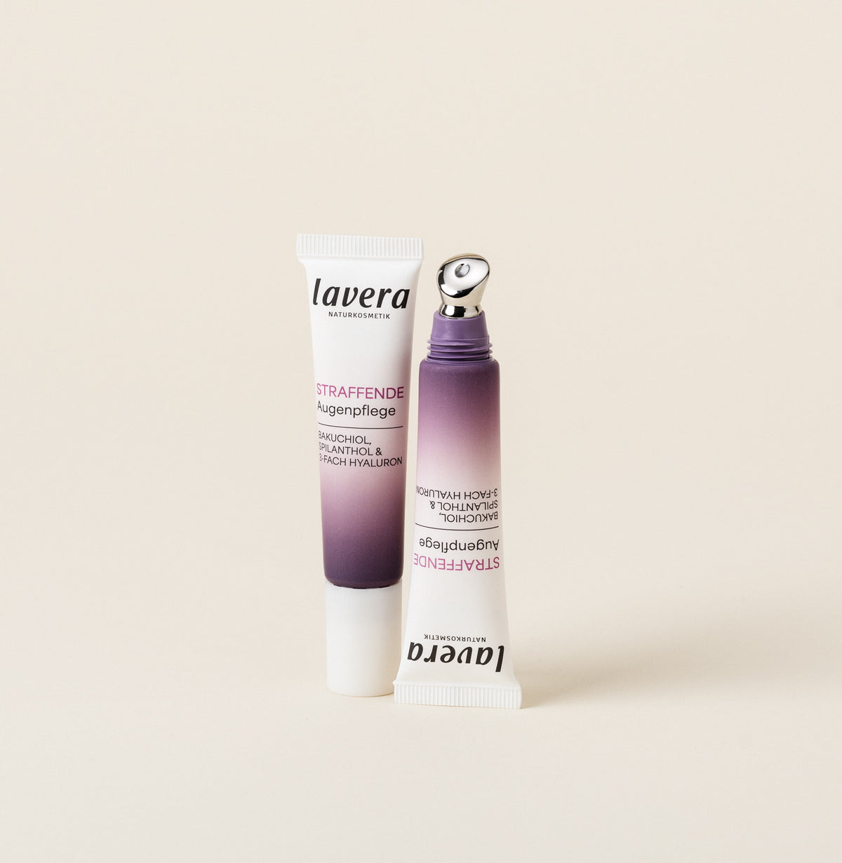Deux produits lavera Soin Contour Des Yeaux Raffermissant dans un emballage violet sont présentés devant un arrière-plan clair.